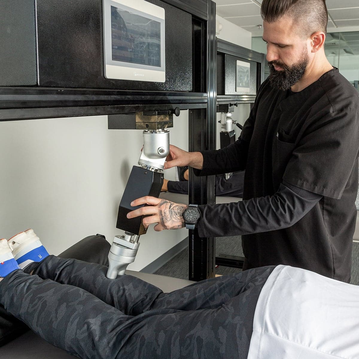 Robotic precision therapy applied to a patient’s leg at Thera Performance Lab in Lake Orion, MI