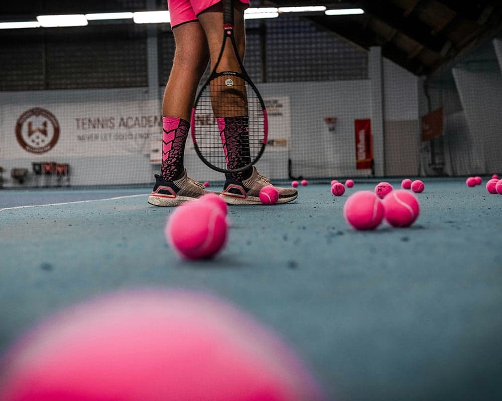 Tennis racket and balls. Repetitive strain injury treatment at Thera Performance Lab in Lake Orion, MI
