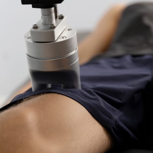 RX2600 therapeutic arm treating knee pain Robotic Physical therapy at Thera Performance Lab in lake Orion, MI